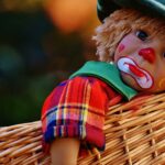 sad clown doll in basket